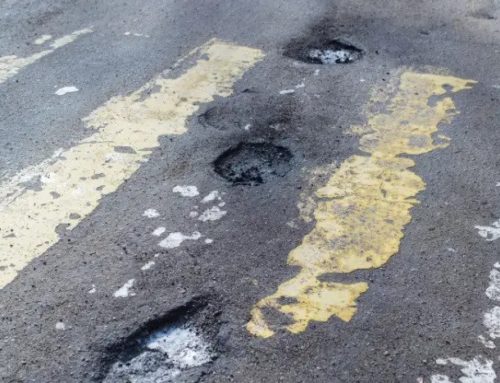 Repair of cracks in asphalt